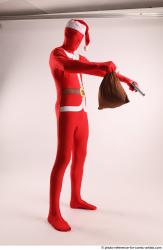 JOEL_ADAMSON CHRISTMAS VALLAIN WITH GUN AND BAG